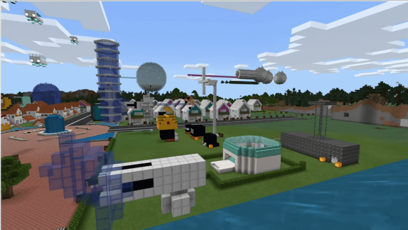 町はMakeCodeで作成。空飛ぶ車が飛び、風力発電所もある